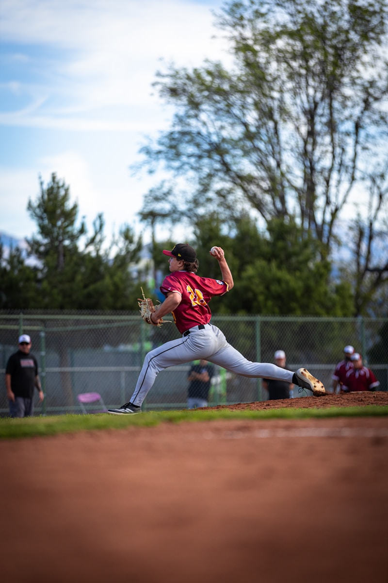 Baseball pitcher throwing a ball during a game.