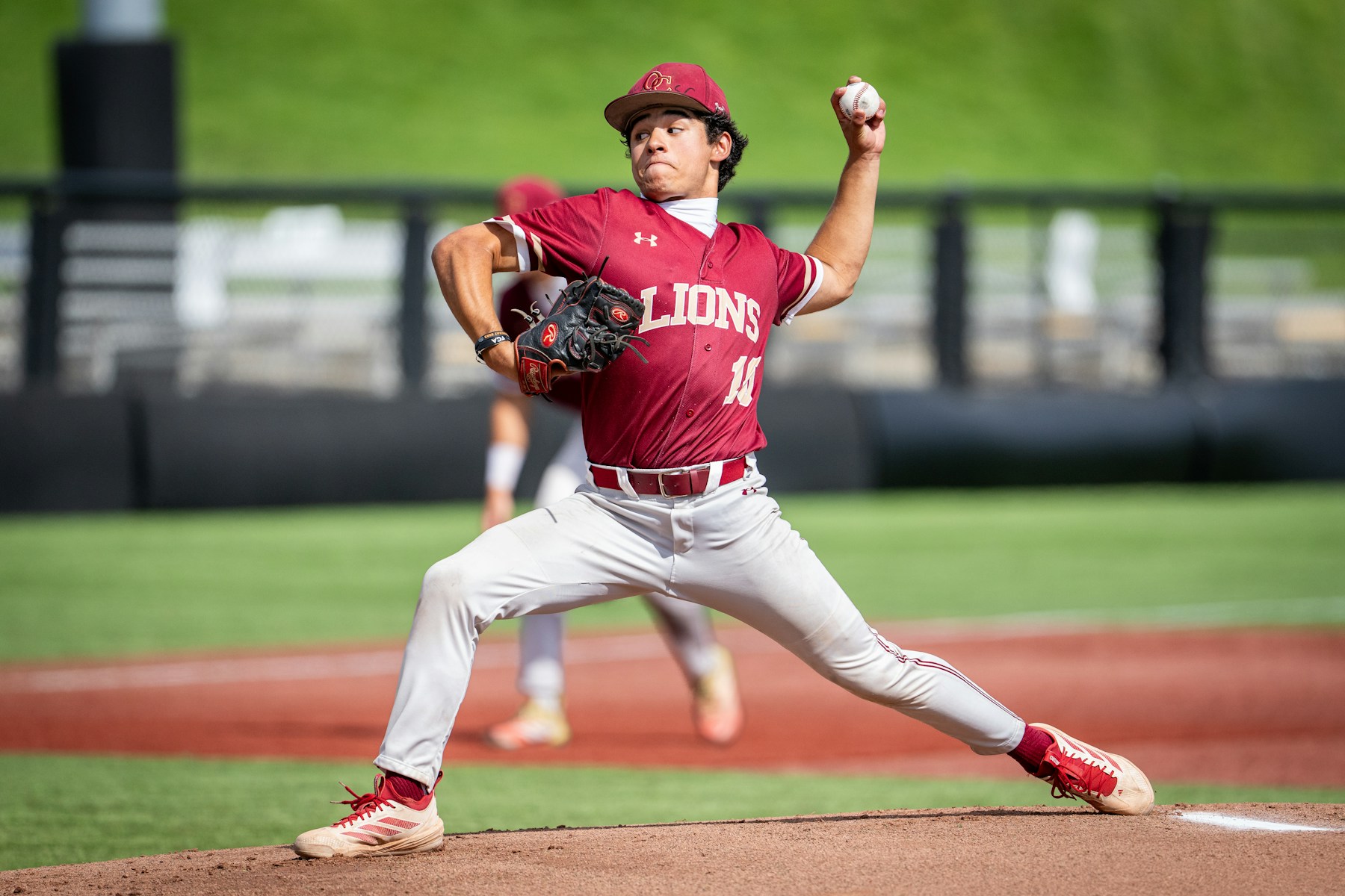 A baseball pitcher throwing a ball during a game.